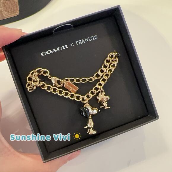 NWT COACH x PEANUTS Snoopy and Woodstock Charm Bracelet CCA50 Gold/Black - Picture 1 of 6